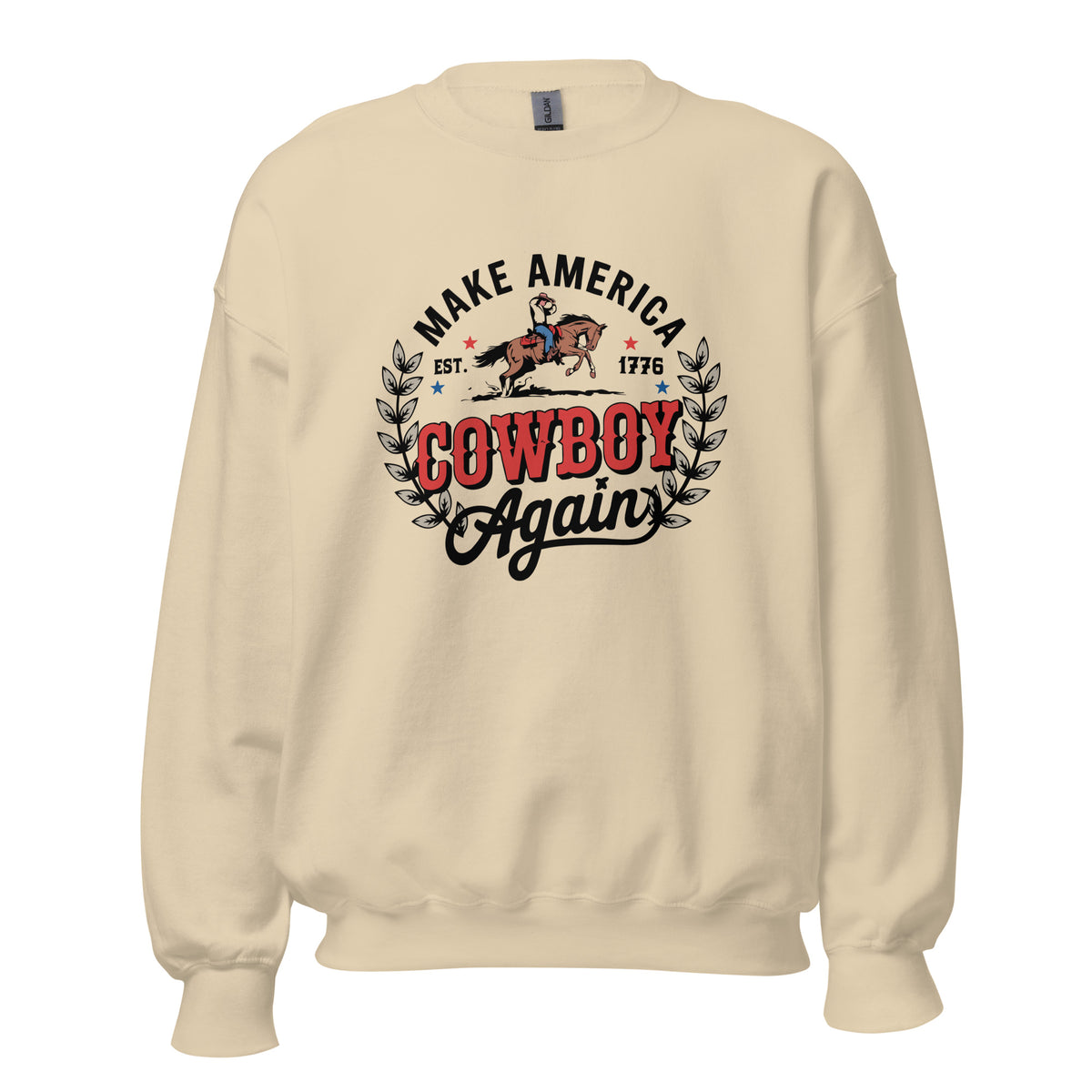 A cream-colored crewneck sweatshirt featuring a vintage-style graphic on the chest that reads 'MAKE AMERICA COWBOY Again' with a cowboy on a horse and leafy accents.