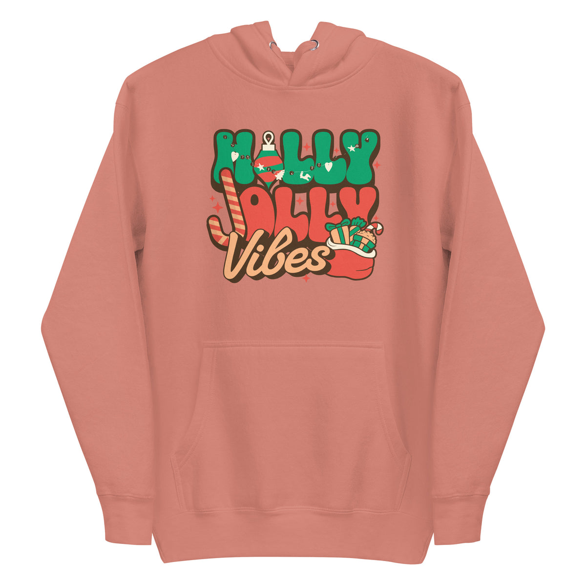 A dusty rose pink pullover hoodie with a colorful graphic on the chest that reads 'Holly Jolly Vibes' in green, red, and brown lettering with Christmas-themed illustrations.