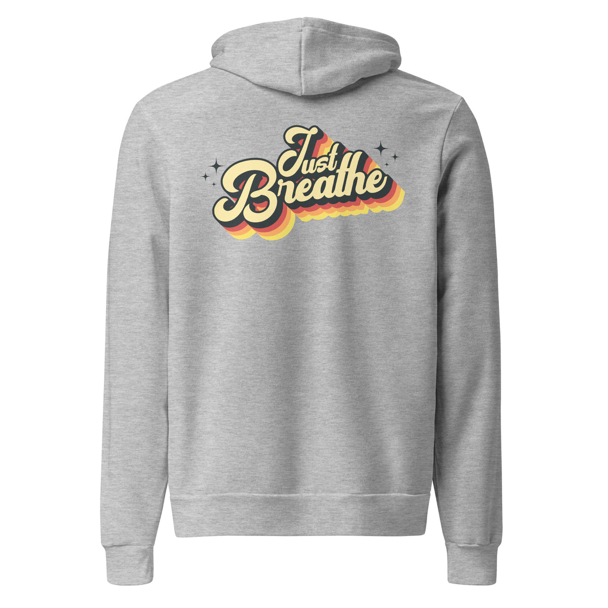 A heather gray pullover hoodie shown from the back, featuring a retro-style graphic that reads 'Just Breathe' in cream and yellow lettering with orange and red shadowing and small star accents.