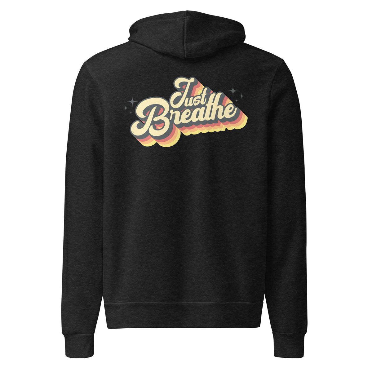 A black pullover hoodie shown from the back, featuring a retro-style graphic with the words 'Just Breathe' in cream, yellow, and orange tones over a wavy cloud-like shape with small star accents.