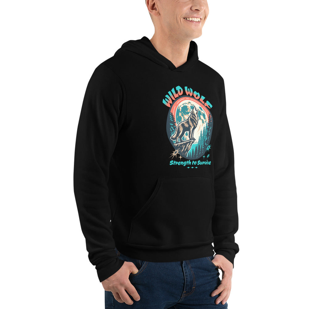 A man wearing a black pullover hoodie with a colorful graphic on the chest featuring a wolf and the text 'WILD WOLF Strength to Survive', paired with blue jeans against a plain white background.