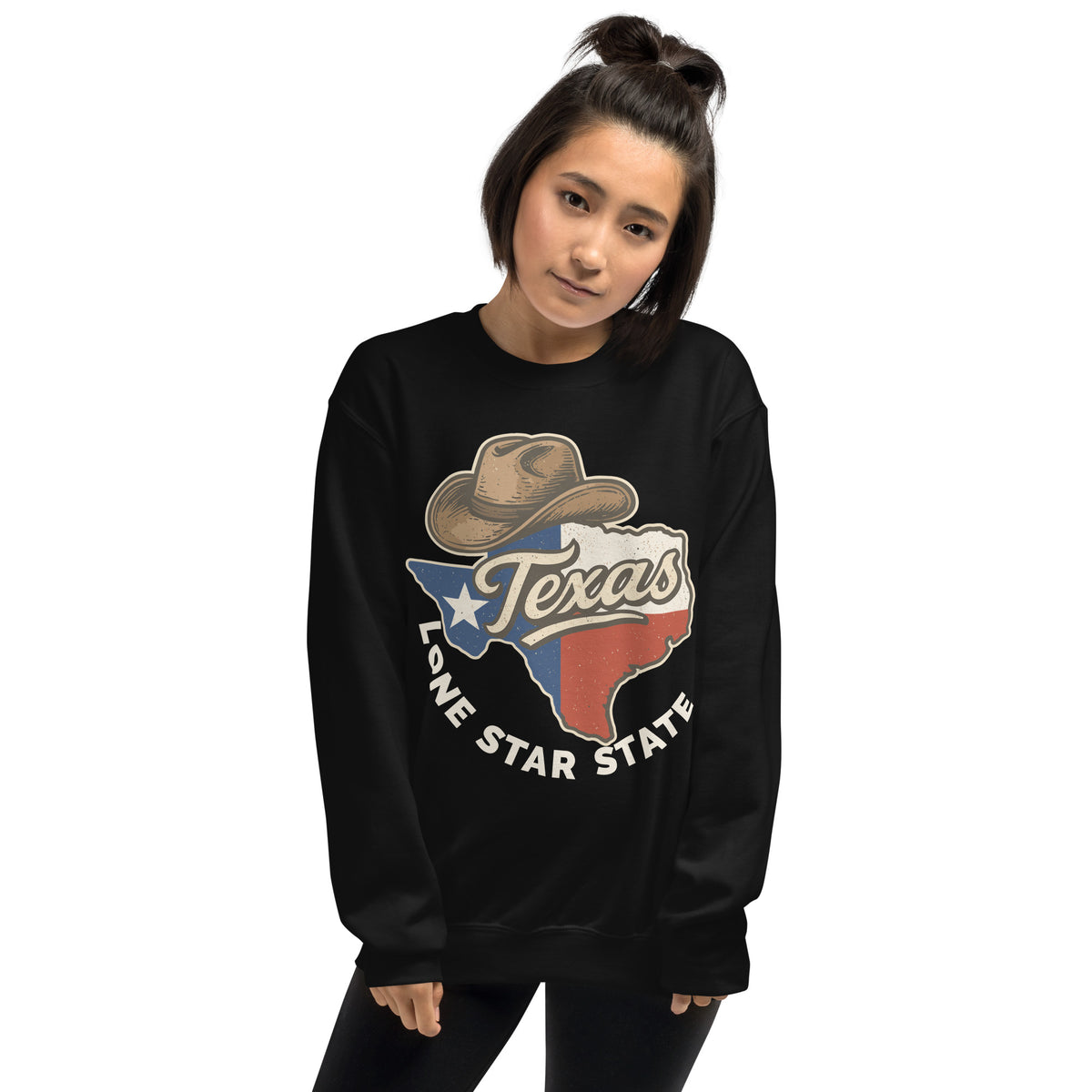 A woman wearing a black crewneck sweatshirt with a graphic of a cowboy hat, the word 'Texas', and the Lone Star State flag design, set against a plain white background.