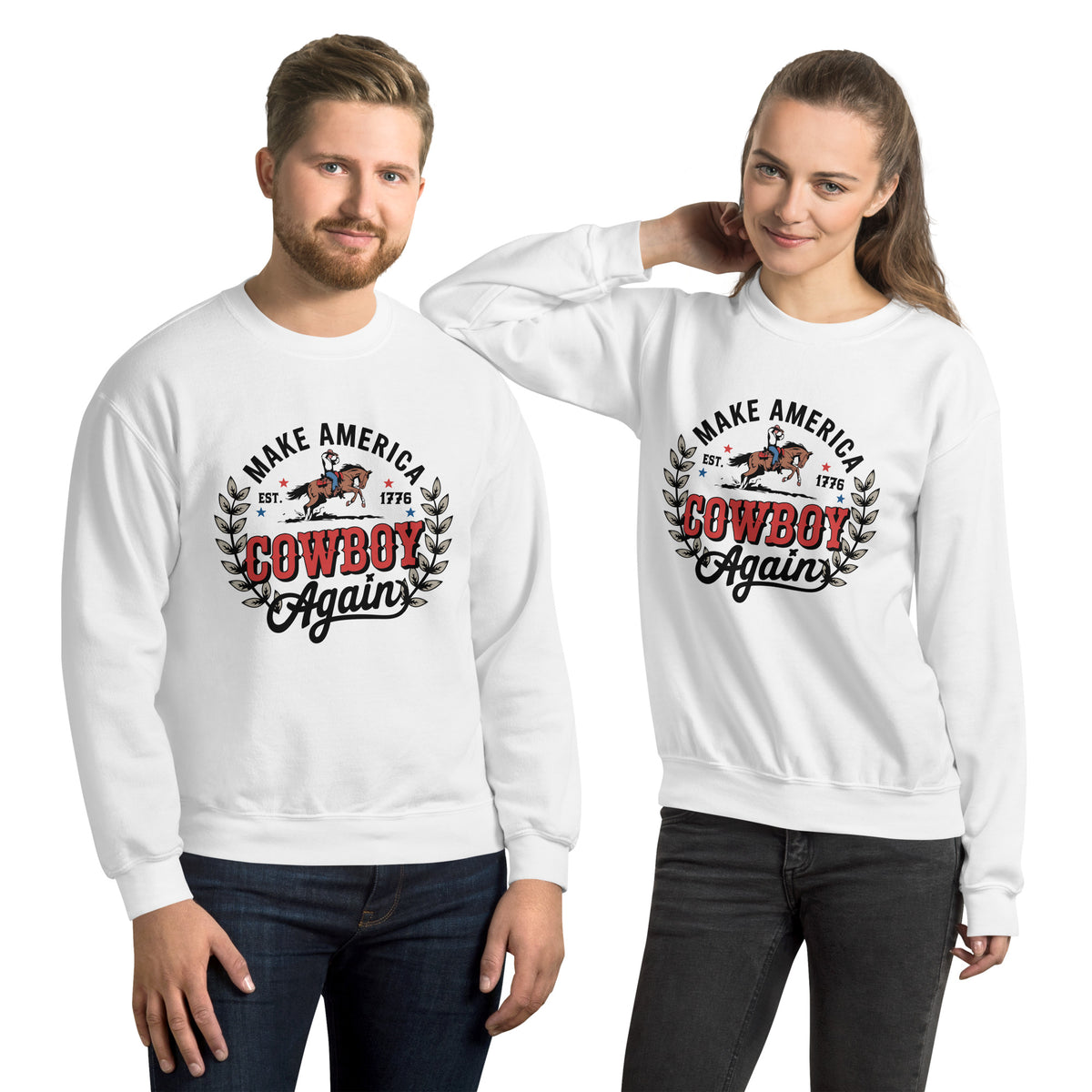 A man and a woman modeling matching white crewneck sweatshirts with a western-themed graphic that reads 'MAKE AMERICA COWBOY Again' with a steer illustration and black leafy accents, against a plain white background.