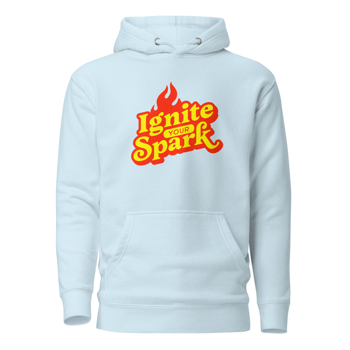 A light blue pullover hoodie with a front kangaroo pocket and a graphic on the chest that reads 'Ignite Your Spark' in yellow and red with a flame icon, shown on a plain white background.