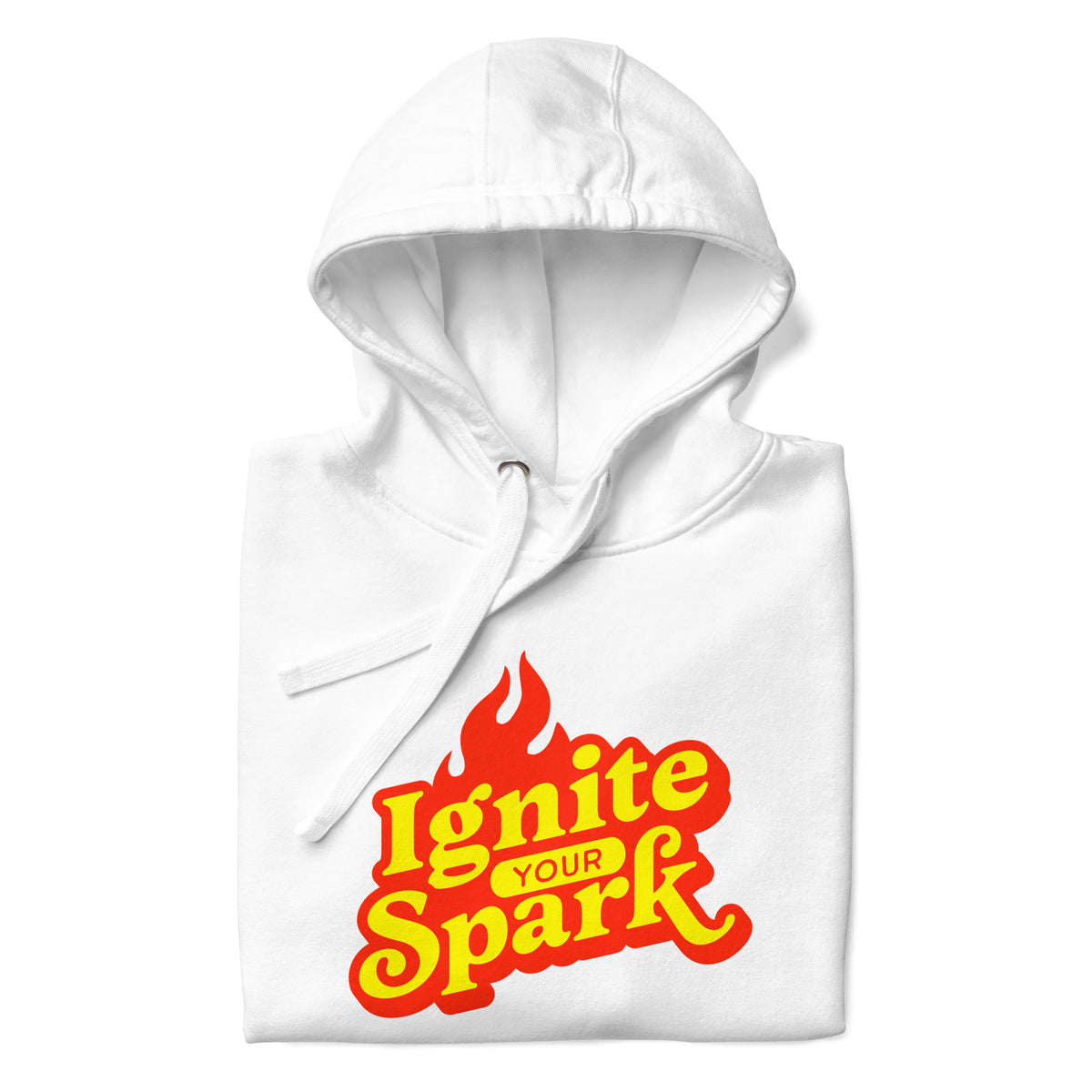 A white folded hoodie with a graphic print on the front that reads 'Ignite YOUR Spark' in yellow and red flame-style lettering, shown on a plain white background.