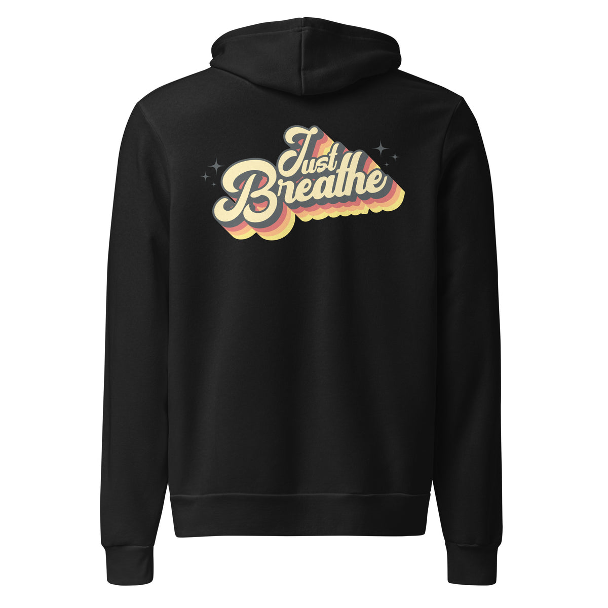 A black pullover hoodie shown from the back, featuring a retro-style graphic with the words 'Just Breathe' in cream and yellow lettering over a wavy rainbow cloud design with small star accents.