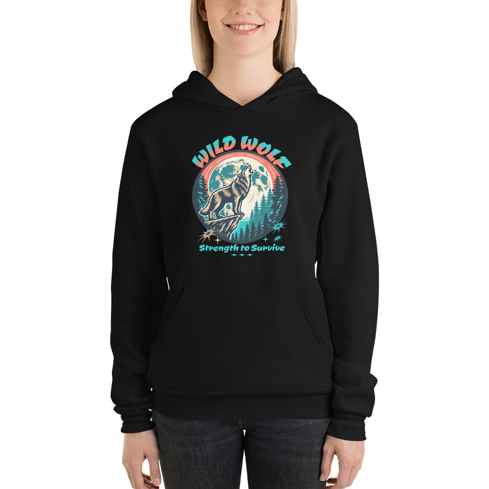 A woman wearing a black pullover hoodie with a colorful graphic on the chest featuring a wolf, mountains, and the text 'WILD WOLF Strength to Survive'.