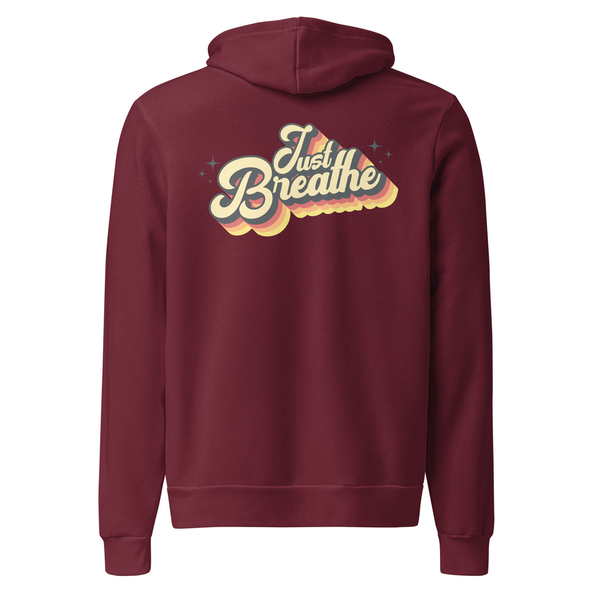 A maroon hoodie shown from the back, featuring a retro-style graphic that reads 'Just Breathe' in cream and yellow with a layered rainbow shadow effect.